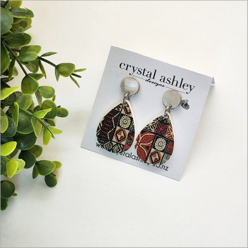 Lightweight teardrop earrings made of Paua shell and acrylic, celebrating Kiwiana aesthetics with a vintage charm.
