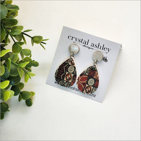 Lightweight teardrop earrings made of Paua shell and acrylic, celebrating Kiwiana aesthetics with a vintage charm.