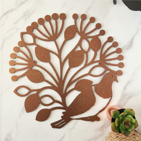 Large brushed copper wall art featuring a Kereru bird in a Pohutukawa circle, celebrating New Zealand's unique flora and fauna.