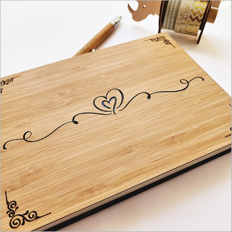 Elegant small guest book with laser cut bamboo design, perfect for weddings and preserving memories.