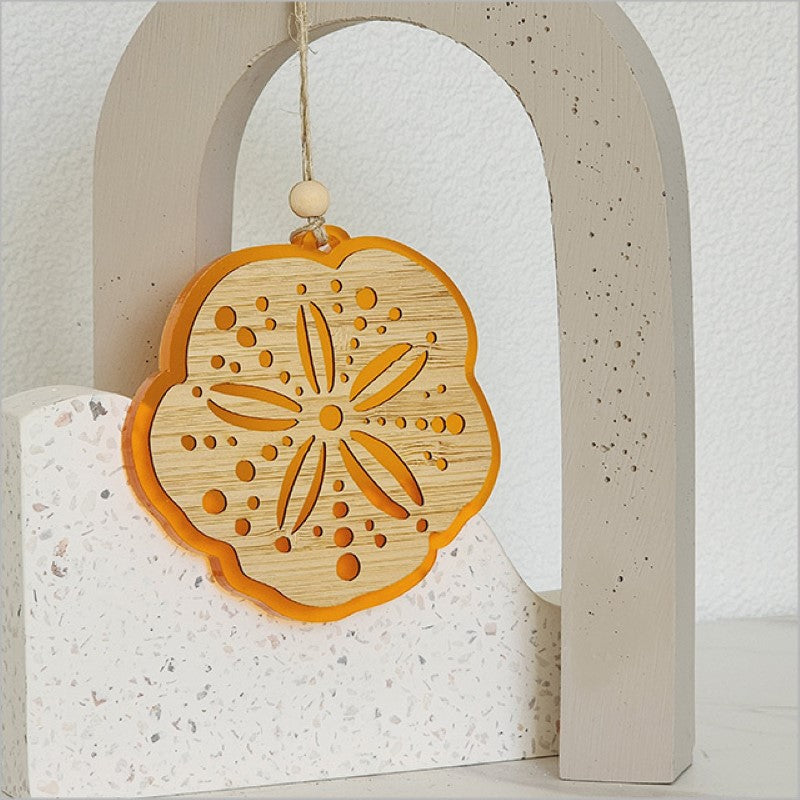 Vibrant orange satin acrylic hanging ornament, laser cut, elegant design for holiday decor, lightweight and ready to hang.