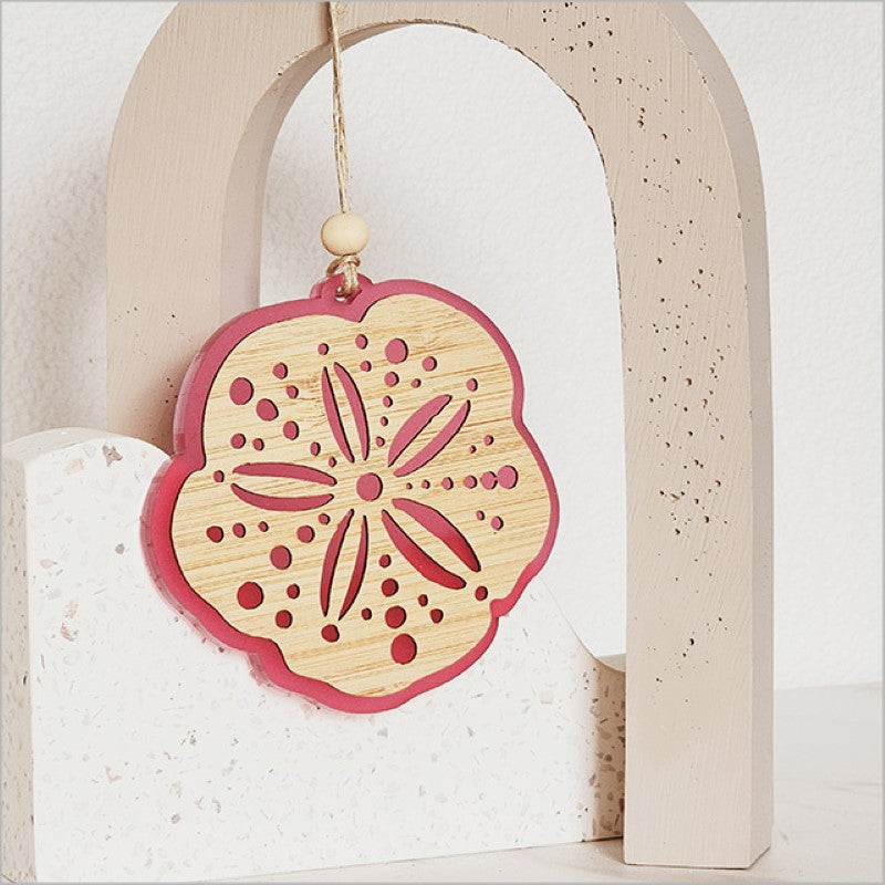 Pink satin acrylic hanging ornament featuring laser-cut bamboo, perfect for elegant home décor or as a thoughtful gift.