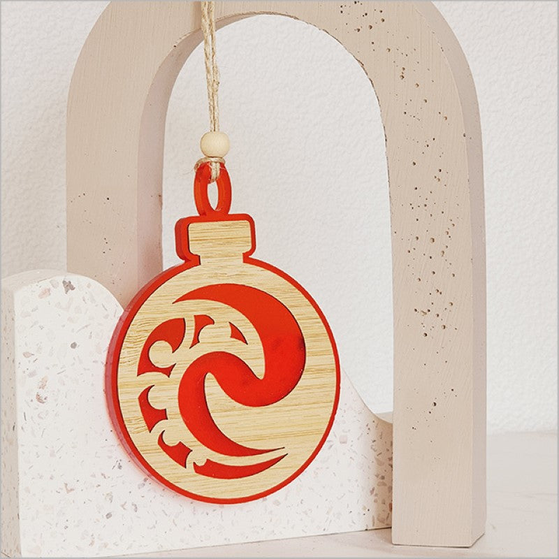 Red satin acrylic Hanging Ornament featuring a unique Koru design, perfect for holiday decor and gifting.