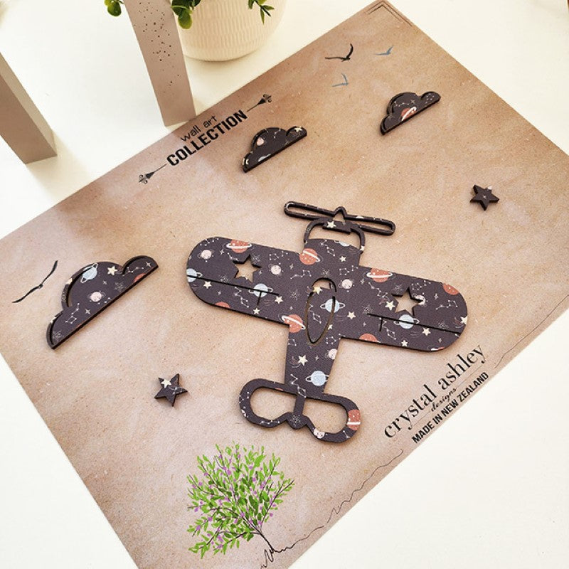 Textured wall art featuring a propeller plane against a night sky with clouds and stars, perfect for children's rooms.
