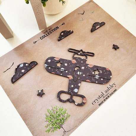 Textured wall art featuring a propeller plane against a night sky with clouds and stars, perfect for children's rooms.