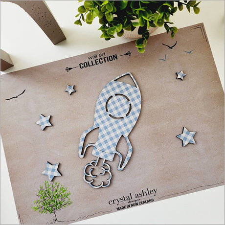 Stylish blue check rocket wall art set featuring a rocket and six stars, perfect for nurseries and playrooms.