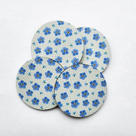 Elegant 10cm Forget Me Not coaster, vibrant floral print on durable MDF with cork base for surface protection.