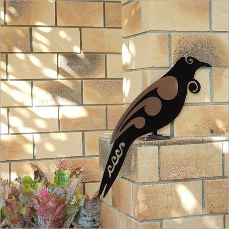Freestanding 2 Tone Moko Tui art piece, 475mm tall, black and brushed copper, ideal for garden decor.