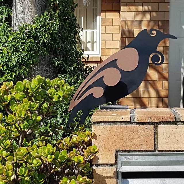 Freestanding 475mm Tui bird sculpture in black and brushed copper, perfect for indoor or outdoor decorative use.
