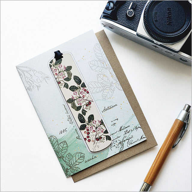 Greeting card featuring Sarah Featon's Puriri watercolor, complemented by a bamboo bookmark describing the iconic plant.