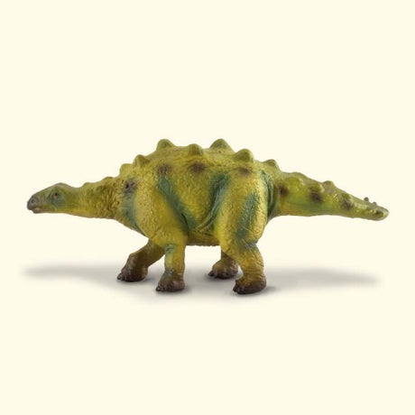 Small hand-painted Stegosaurus baby figurine, featuring distinctive plates and spikes, perfect for play or display.