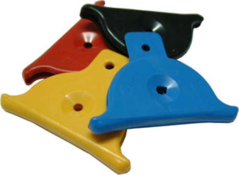Vibrant plastic shepherd whistle in assorted colors, ideal for dog training and livestock management.