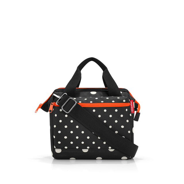 Reisenthel All Rounder Cross Bag in Mixed Dots, compact yet spacious with adjustable strap and multiple pockets for essentials.