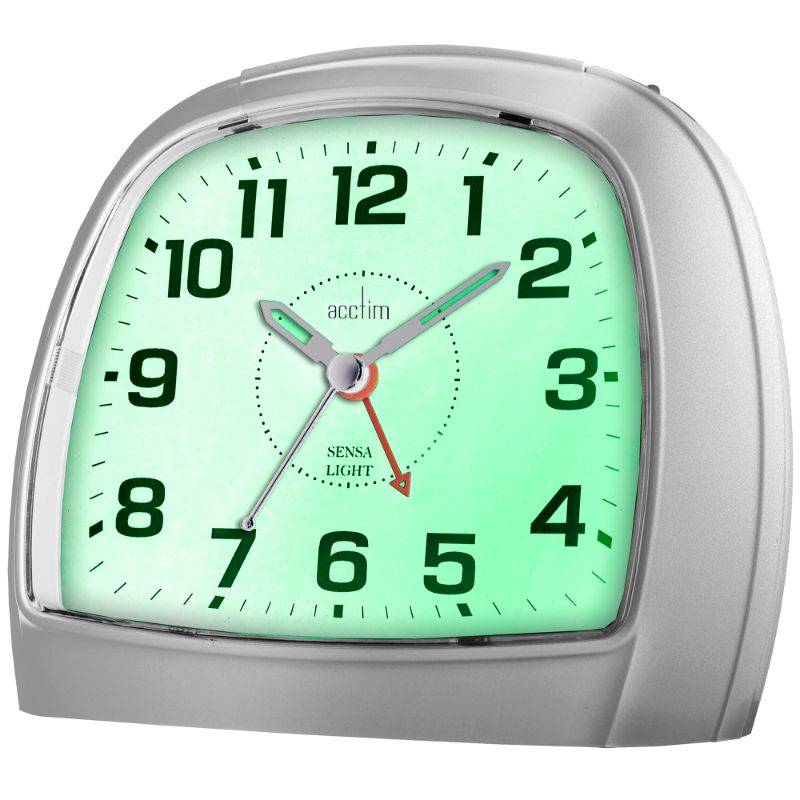 Sleek silver alarm clock with non-ticking sweep hand and automatic night light sensor, ideal for restful sleep.