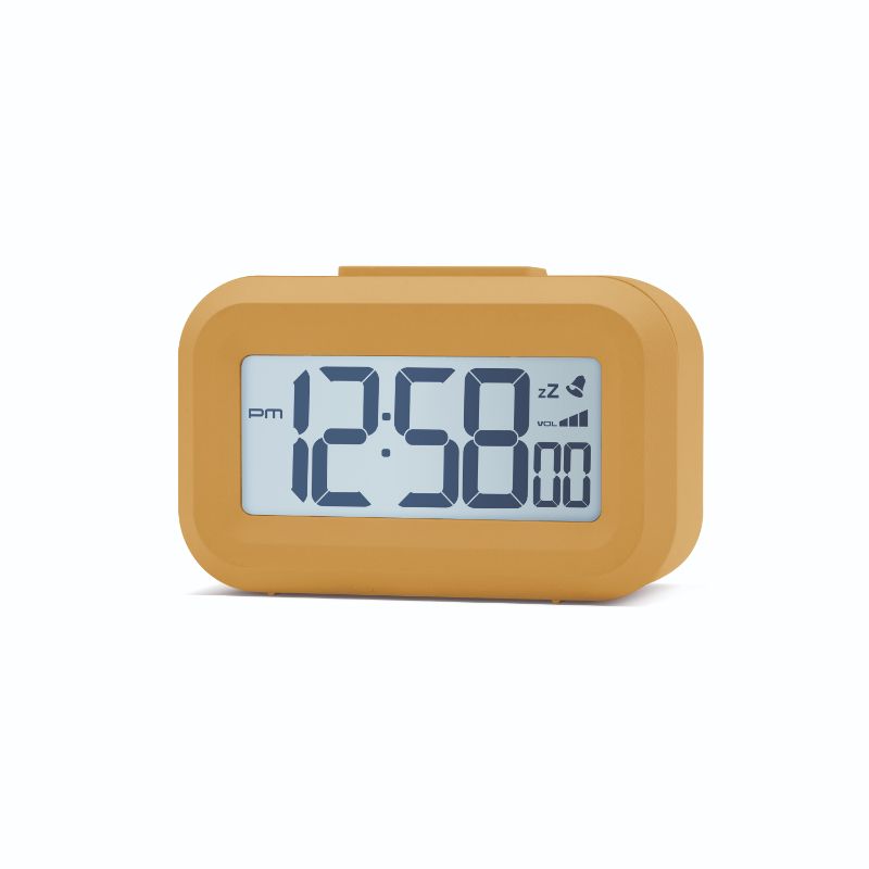 Stylish mustard yellow LCD alarm clock with snooze function and white backlight, perfect for bedside or office use.