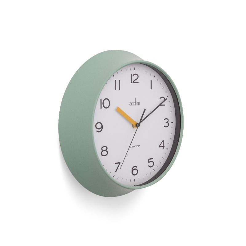 Mint green wall clock with bold numbers, 29cm diameter; combines retro charm with modern style.
