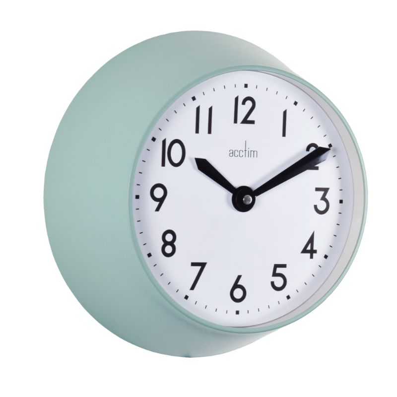 Matt green metal wall clock with deep profile, quartz movement, and glass lens, blending retro style and functionality.