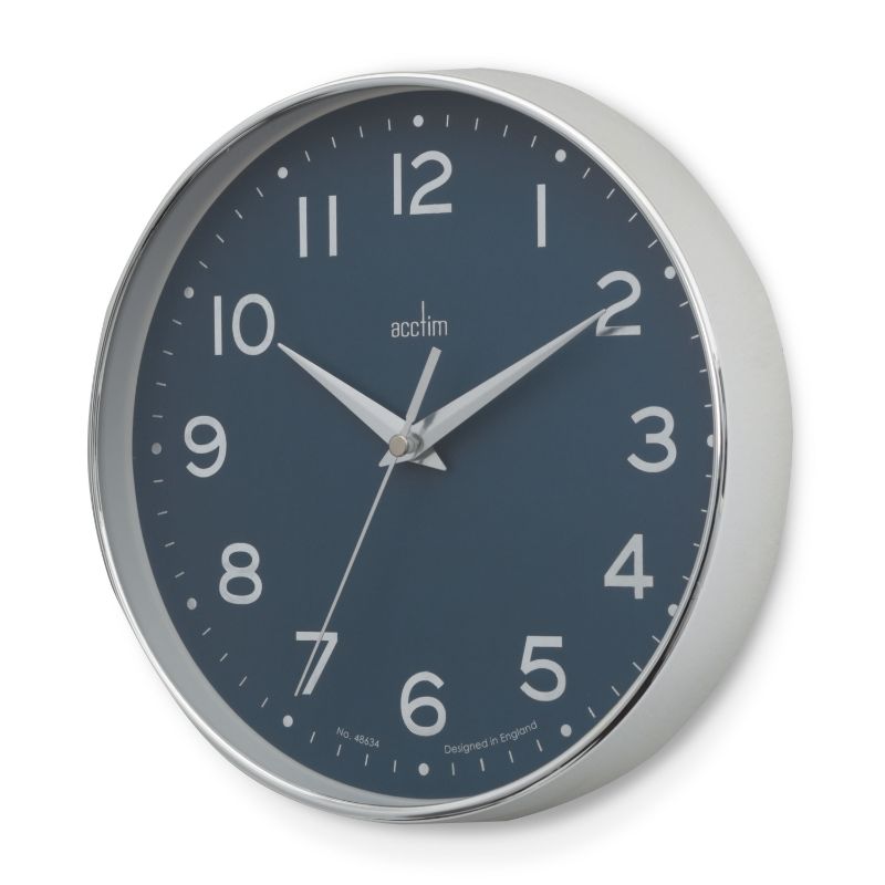 Sleek chrome wall clock with blue embossed dial and silver scissor hands, perfect for modern and traditional decor.