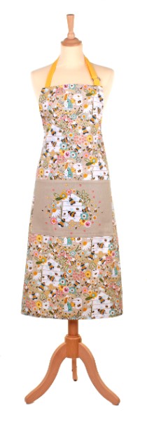 Cotton apron with bee and daisy design, adjustable straps, soft oatmeal color, perfect for stylish cooking experiences.