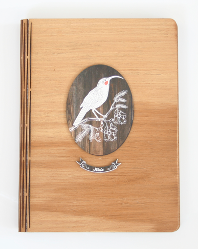 Elegant dark wood bamboo journal with tribal husky design, perfect for notes and gifts.