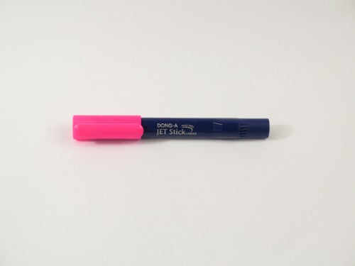 Dong-A Jet Stick Highlighter in vibrant pink, featuring a fine tip and transparent housing for ink visibility.