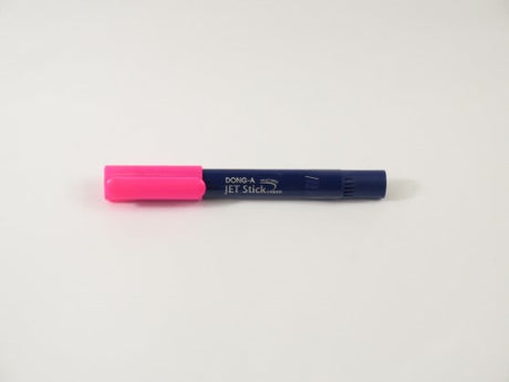 Dong-A Jet Stick Highlighter in vibrant pink, featuring a fine tip and transparent housing for ink visibility.
