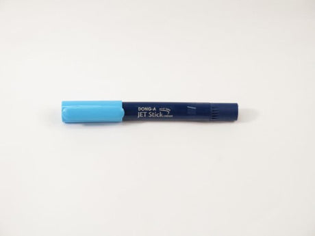 Dong-A Jet Stick Highlighter in Blue, ideal for note-taking with precision ink and transparent housing to monitor ink levels.