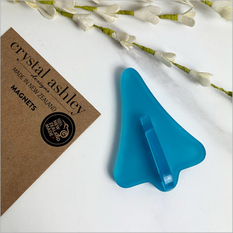 Teal satin acrylic magnet shaped like a jet plane, perfect for notes and photos, with a frosted finish for elegance.