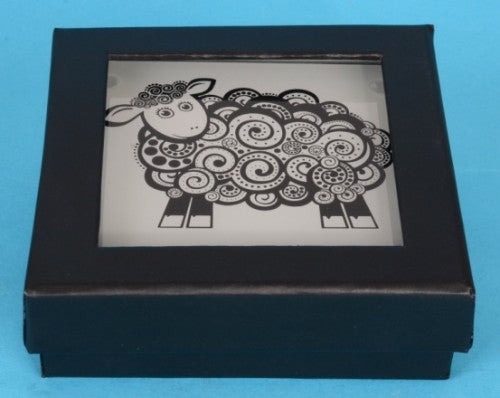 Set of four tempered glass coasters featuring unique New Zealand Koru sheep designs, ideal for home decor and gifting.