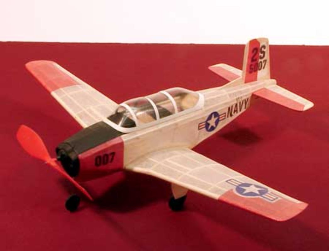 Balsa Glider T-34 with 44cm wingspan, vibrant decals, easy assembly, and smooth performance for model aviation enthusiasts.
