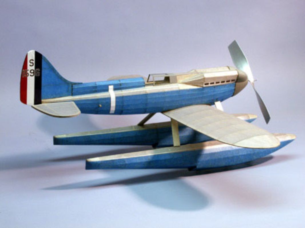 24-inch balsa wood glider with rubber propulsion, designed for stability and long flights, perfect for all ages.