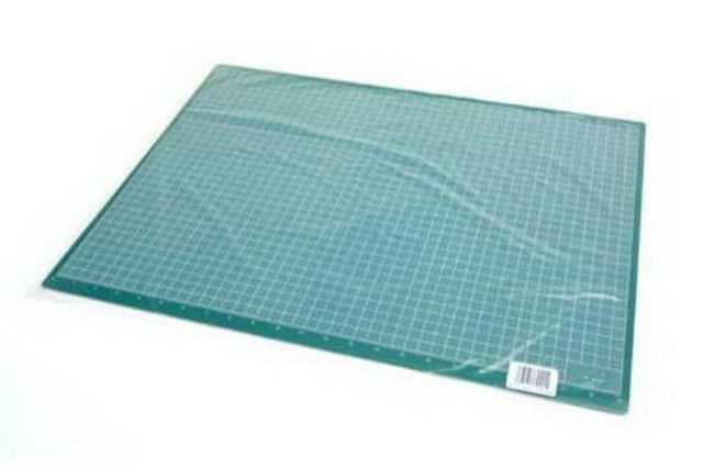 Excel 18x24 Cutting Mat in green, ideal for precise cutting in crafting, sewing, and quilting projects.