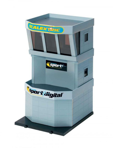 Durable plastic pit building control tower for Scalextric tracks, features customizable decals and easy assembly.
