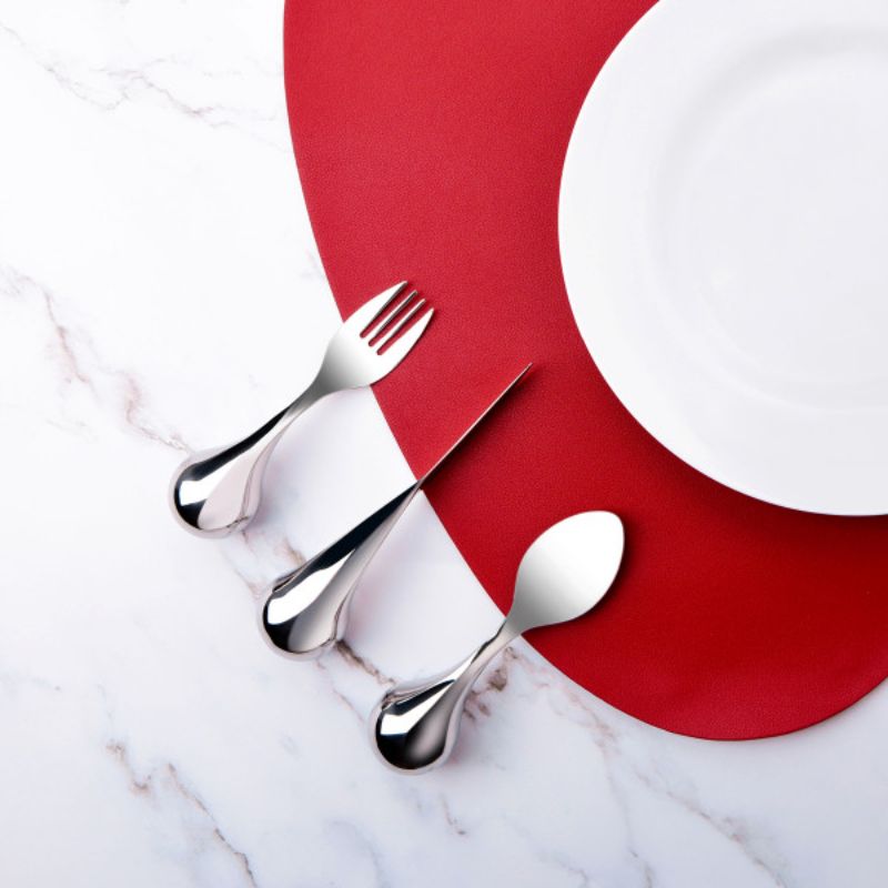 Ergonomic fork with ball-shaped handle for easy grip, designed for individuals with limited wrist motion.