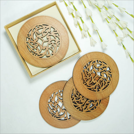 Kowhaiwhai Circle coasters in laser-cut Rimu veneer featuring unique Maori designs, ideal for protecting surfaces and enhancing decor.