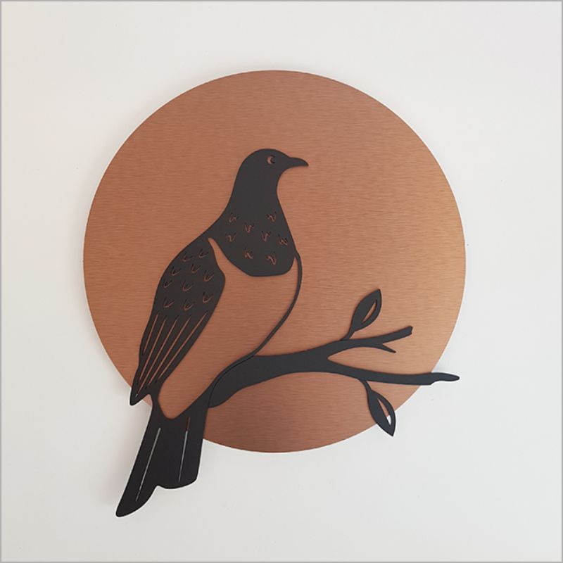 Brushed copper and black acrylic wall art featuring a kereru silhouette, 37cm diameter, ideal for indoor/outdoor decor.
