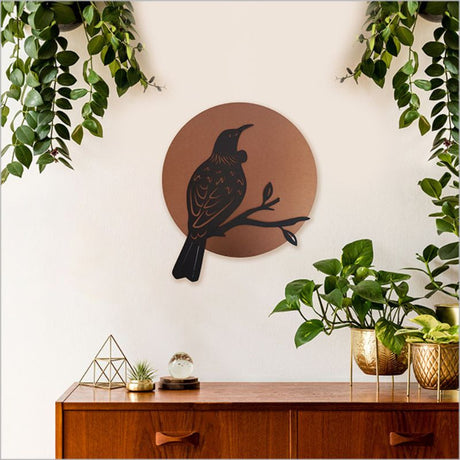 Elegant 37cm brushed copper and black acrylic wall art featuring a Tui design, perfect for indoor or outdoor display.