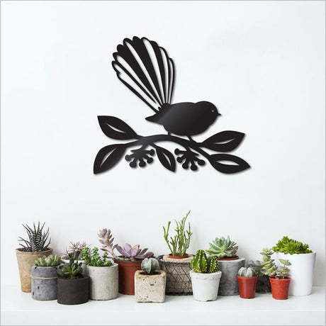 Large wall art featuring a fantail on vibrant pohutukawa, crafted from durable black ACM, perfect for indoor or outdoor decor.