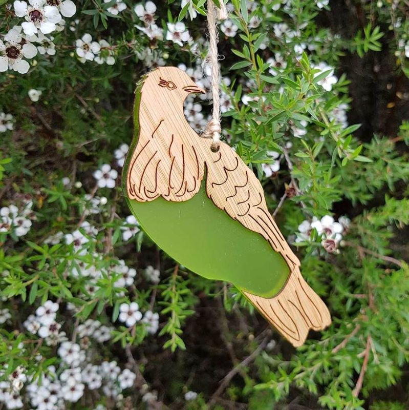 Eco-friendly Kereru hanging ornament in lime green satin acrylic and bamboo, perfect for nature-inspired decor.