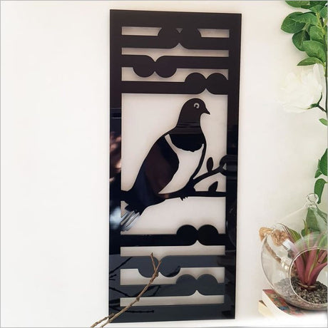 Black ACM wall art panel featuring a Kereru and Koru design, perfect for indoor and outdoor decor. Size: 230mm x 550mmH.