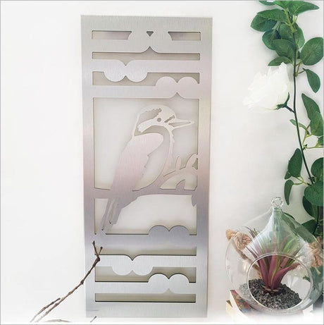 Brushed silver wall art panel featuring intricate Kingfisher and Koru design, perfect for indoor and outdoor decor.