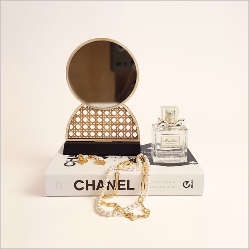 Elegant rattan earring stand with built-in mirror, perfect for jewelry display and organization, handmade from natural materials.