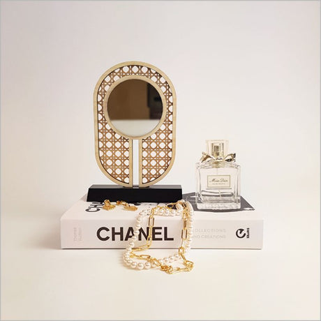 Elegant rattan-inspired earring stand with mirror, ideal for organizing and displaying jewelry in style.