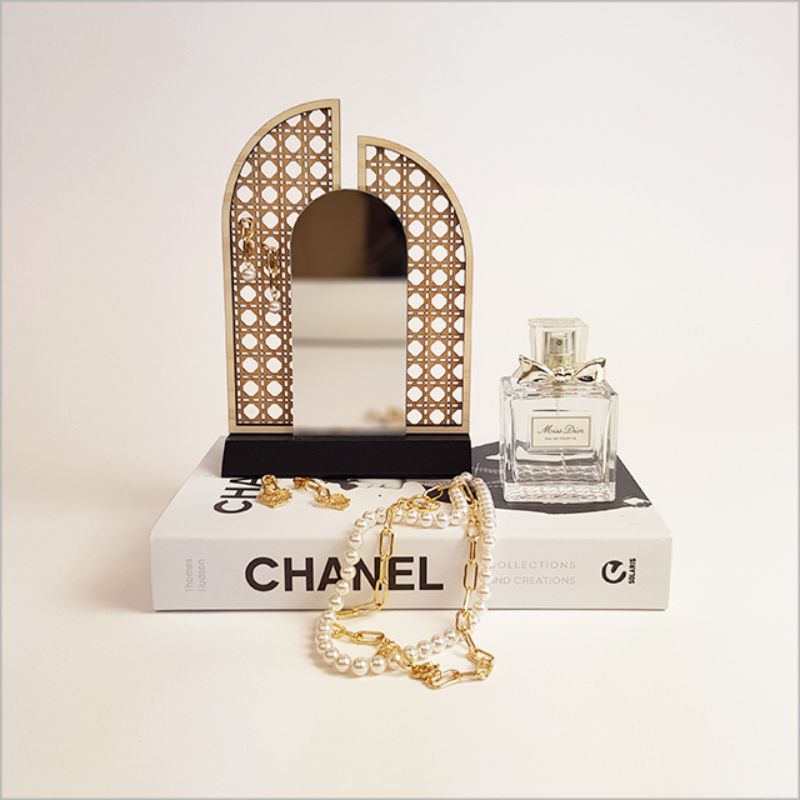 Elegant rattan earring stand with mirror, perfect for organizing earrings and enhancing your decor.