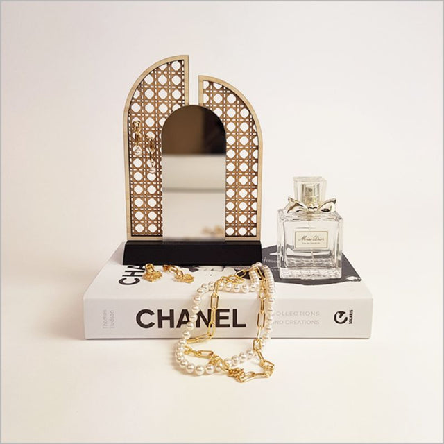 Elegant rattan earring stand with mirror, perfect for organizing earrings and enhancing your decor.