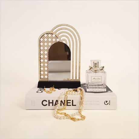 Stylish rattan earring stand with mirror, perfect for showcasing earrings and enhancing decor, handcrafted from natural materials.