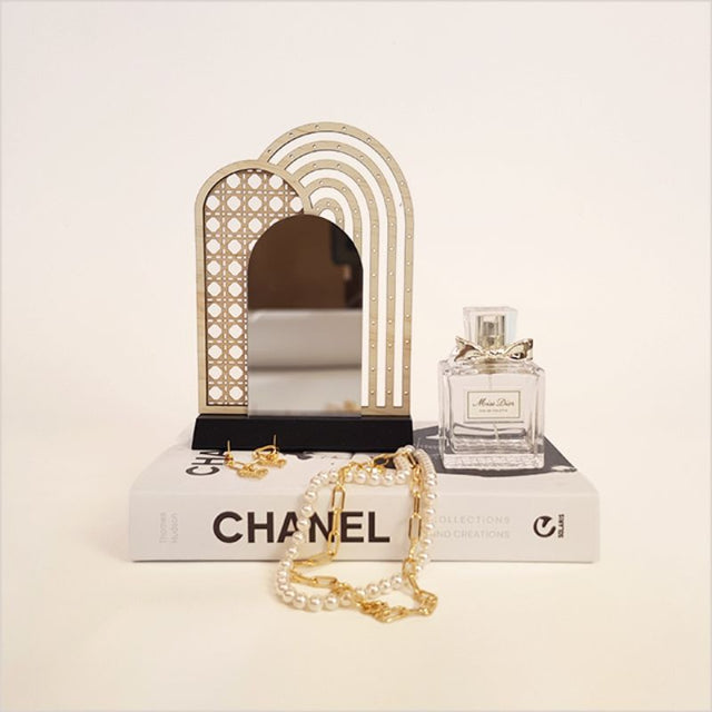 Stylish rattan earring stand with mirror, perfect for showcasing earrings and enhancing decor, handcrafted from natural materials.