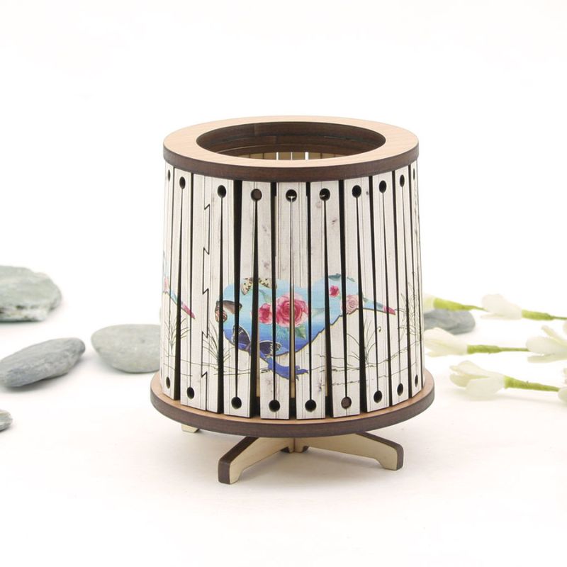 Round LED tealight holder with floral kiwi design, 8.5cm, features a color-changing LED candle for elegant ambiance.
