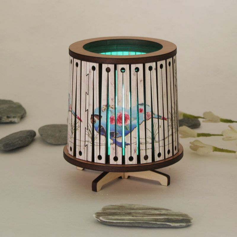Round LED tealight holder with floral kiwi design, 8.5cm diameter, featuring color-changing LED for elegant ambiance.