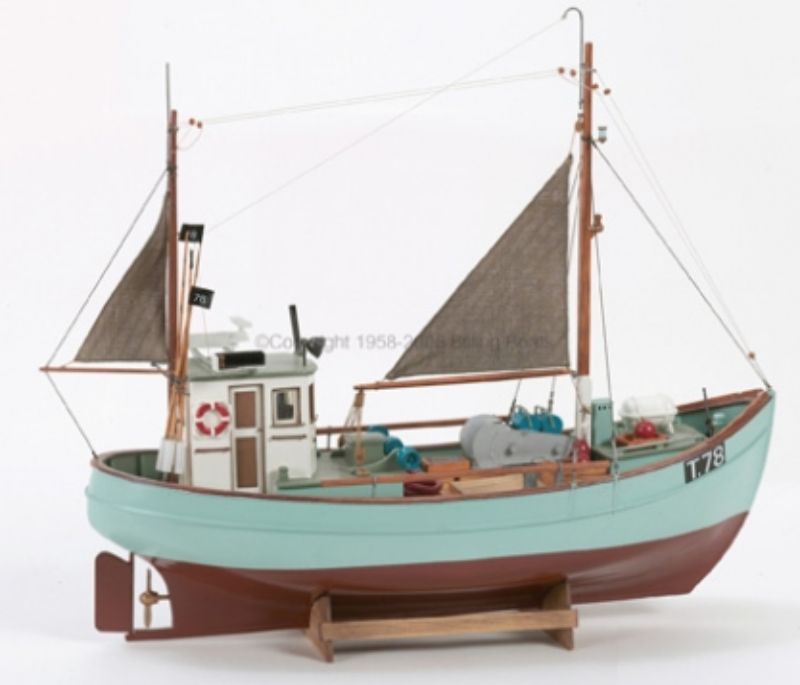 Unassembled wooden model kit of the 1/30 Norden Cutter, resembling classic Danish fishing vessels from the 1930s.